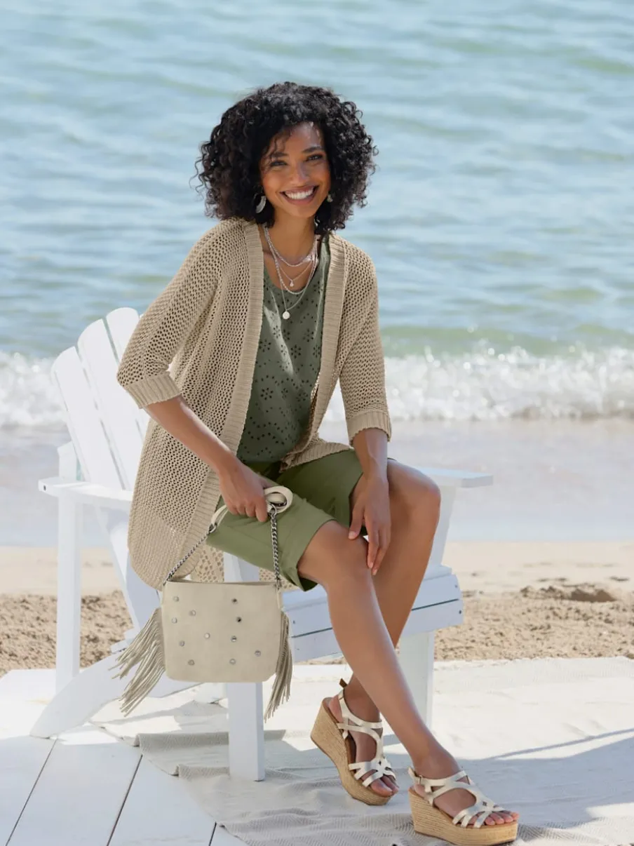 Veste en tricot ajouré avec manches chauve-souris et motif léger