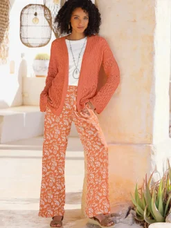 Veste en tricot ajouré à manches longues avec motif léger
