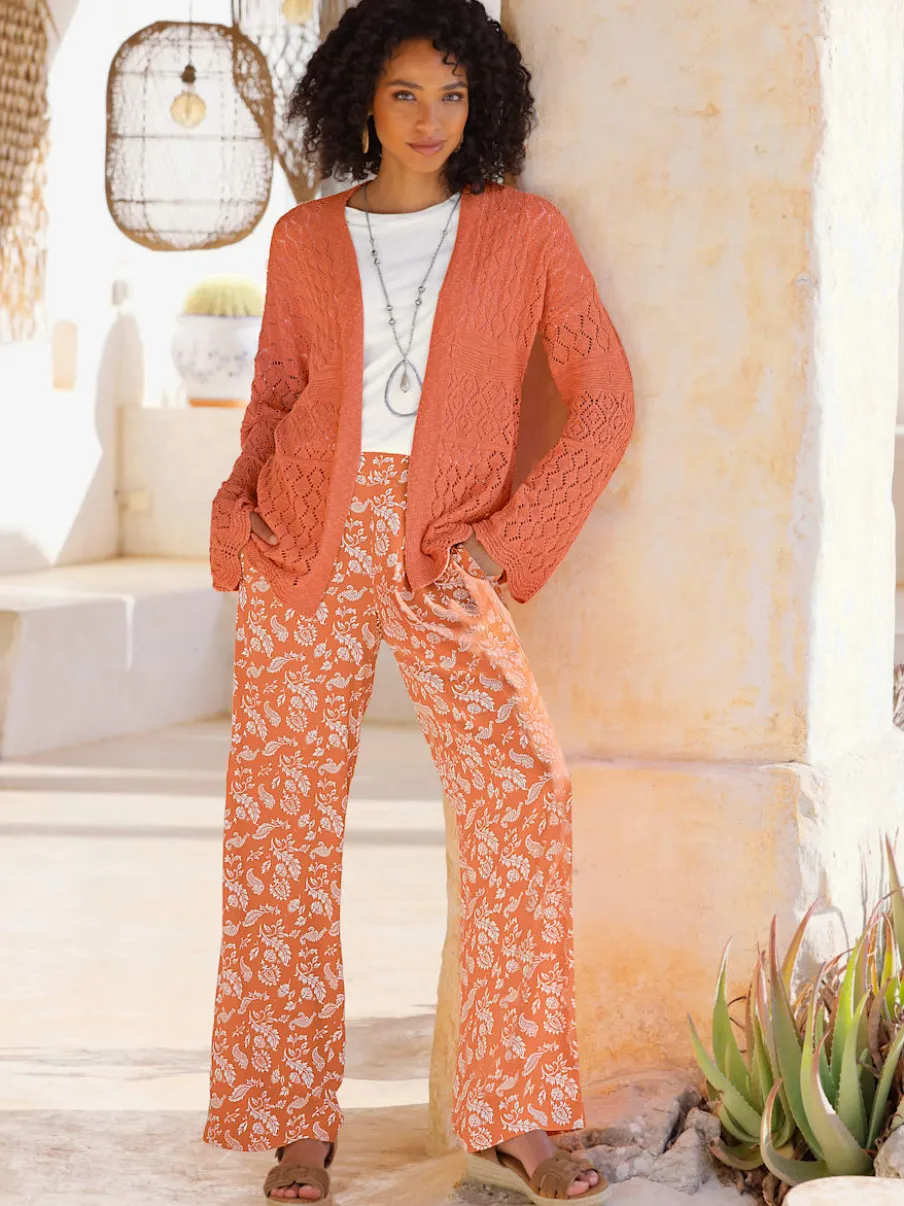 Veste en tricot ajouré à manches longues avec motif léger