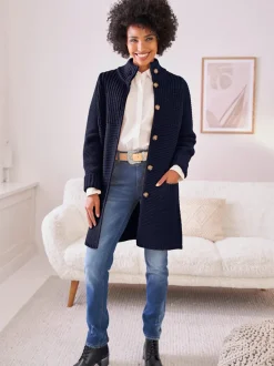 Veste en tricot avec col montant et poches fendues