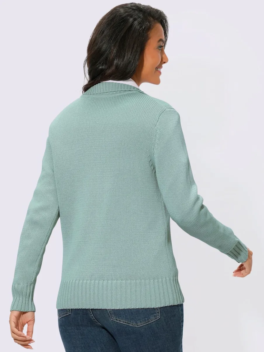 Veste en tricot avec glissière et finitions côtelées