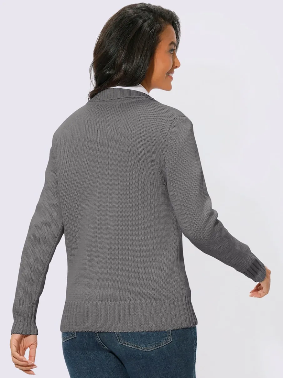 Veste en tricot avec glissière et finitions côtelées