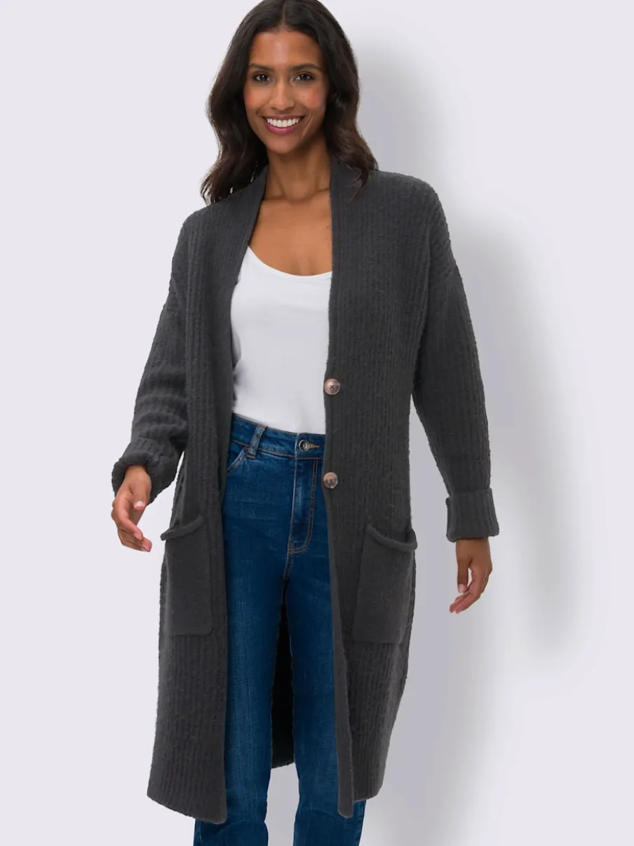 Veste en tricot doux à grosses mailles avec poches