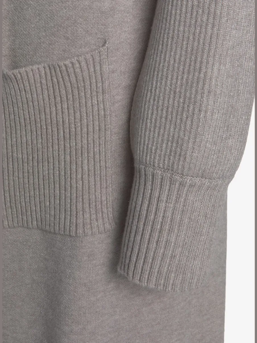 Veste en tricot long avec col châle et poches ouvertes