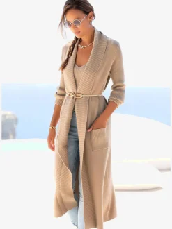 Veste en tricot long avec col châle et poches ouvertes