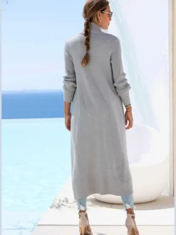 Veste en tricot long avec col châle et poches ouvertes