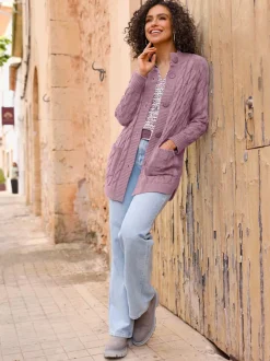 Veste en tricot torsadé avec col montant et poches