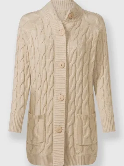 Veste en tricot torsadé avec col montant et poches