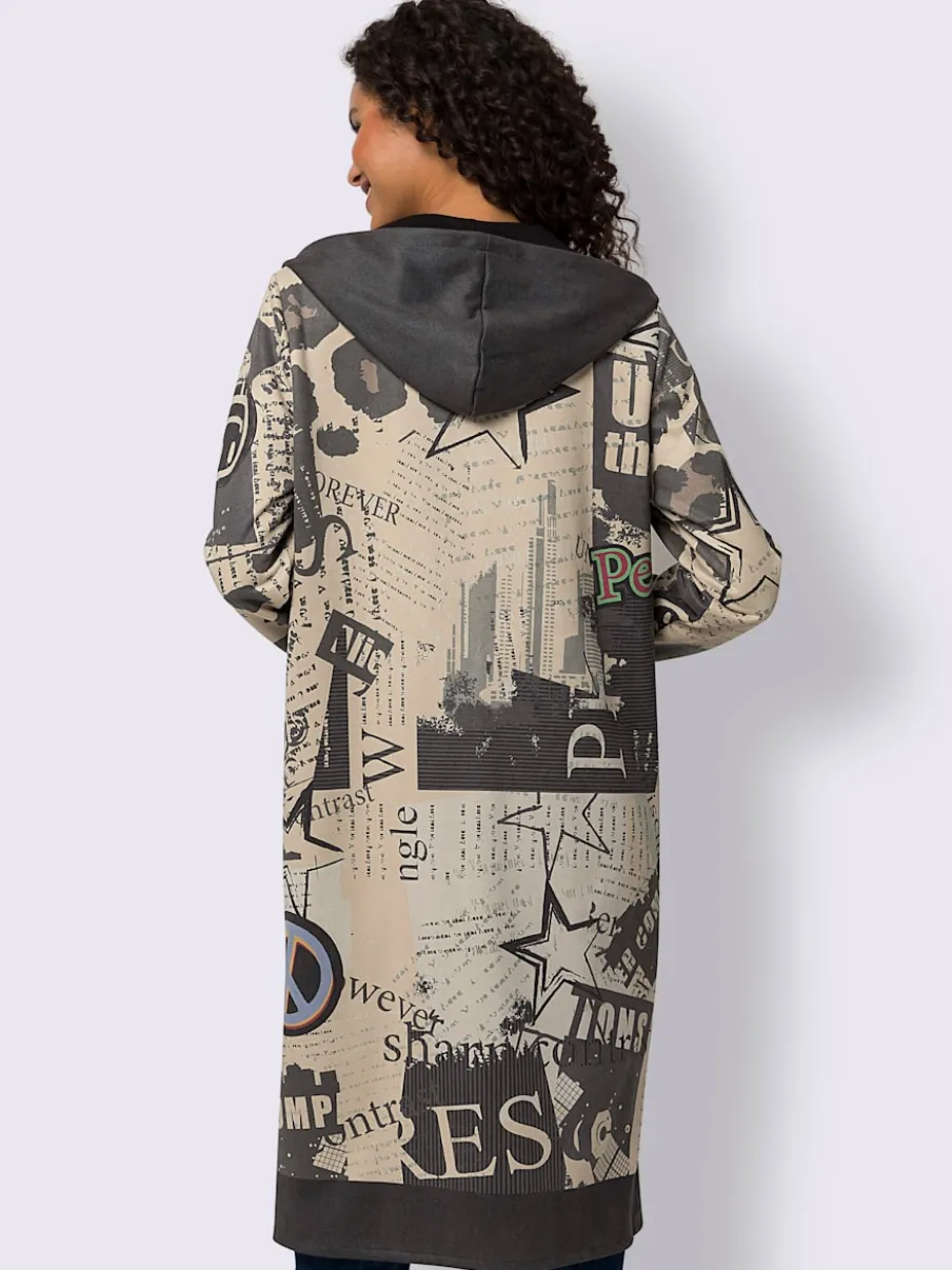 Veste légère à capuche avec motifs graphiques et poches.