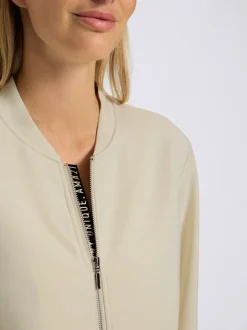 Veste légère à col montant avec glissière et bords-côtes extensibles