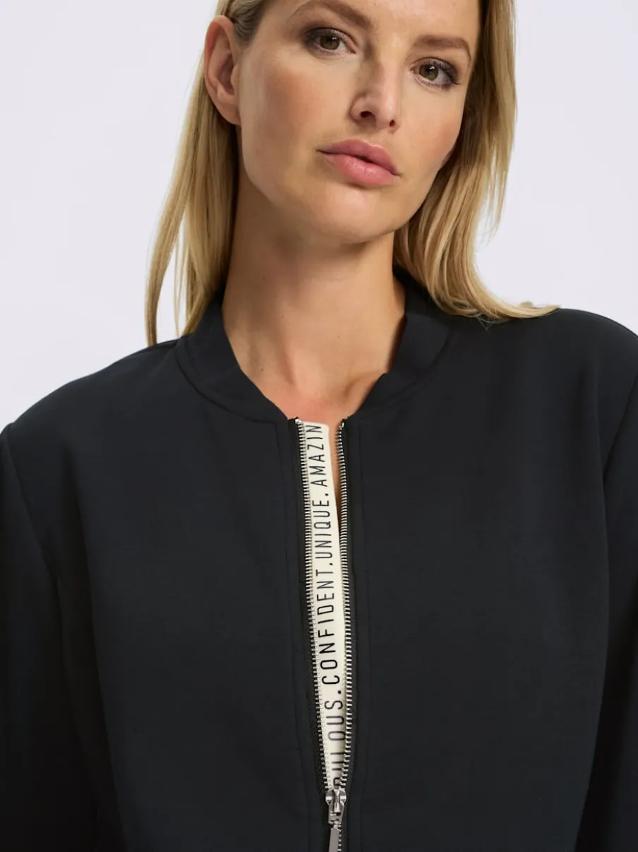Veste légère à col montant avec glissière et bords-côtes extensibles