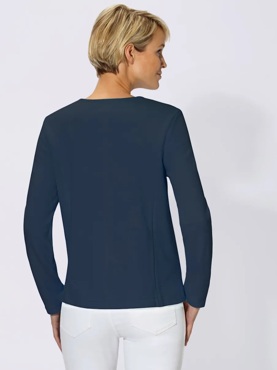 Veste légère en jersey avec finitions soignées et poches.