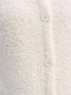 Veste longue en tricot avec col montant et poches plaquées