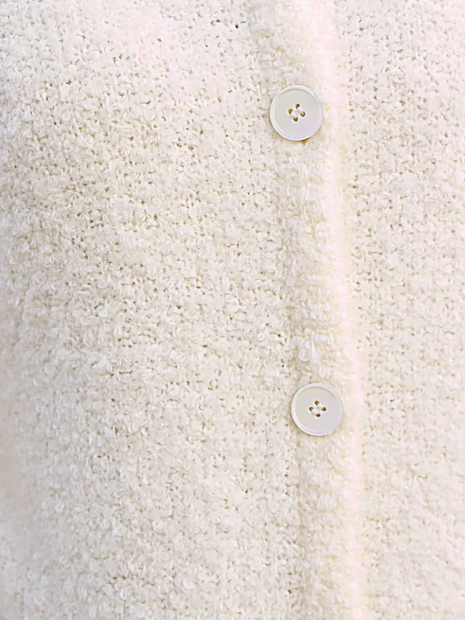 Veste longue en tricot avec col montant et poches plaquées