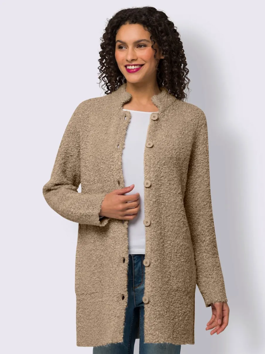 Veste longue en tricot avec col montant et poches plaquées