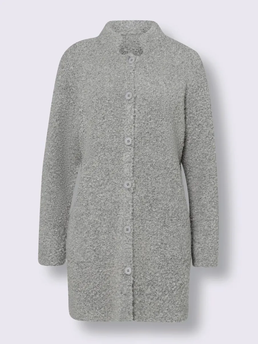 Veste longue en tricot avec col montant et poches plaquées