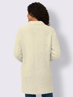 Veste longue en tricot avec col montant et poches plaquées