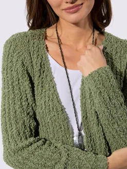 Veste longue en tricot avec manches longues et poches pratiques