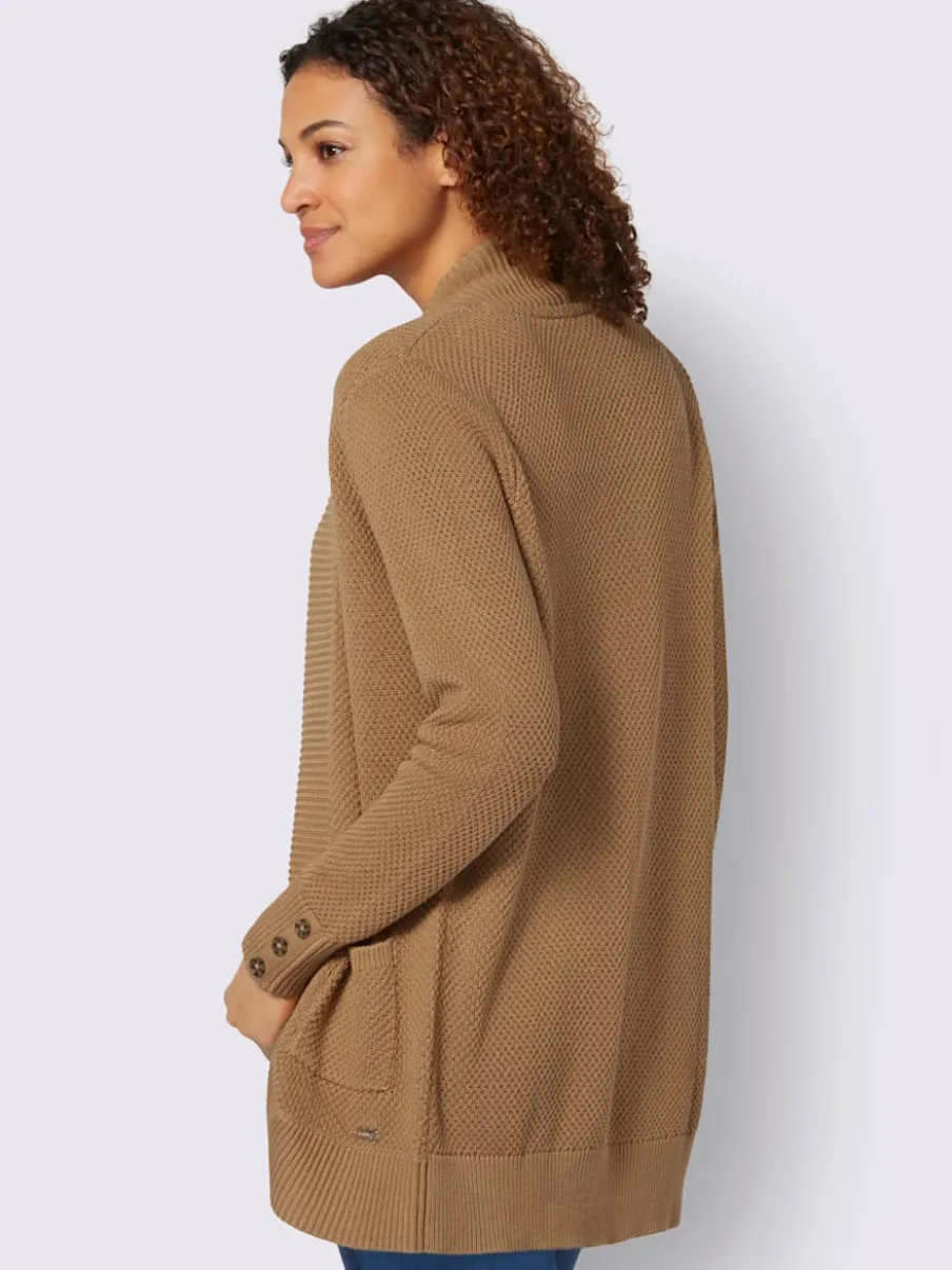 Veste longue en tricot avec poches et boutons côtelés