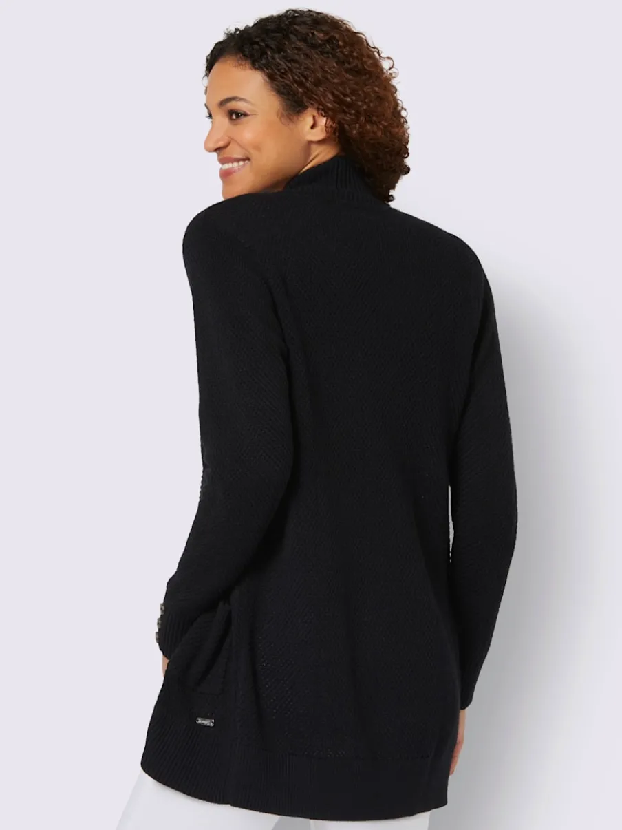 Veste longue en tricot avec poches et boutons côtelés