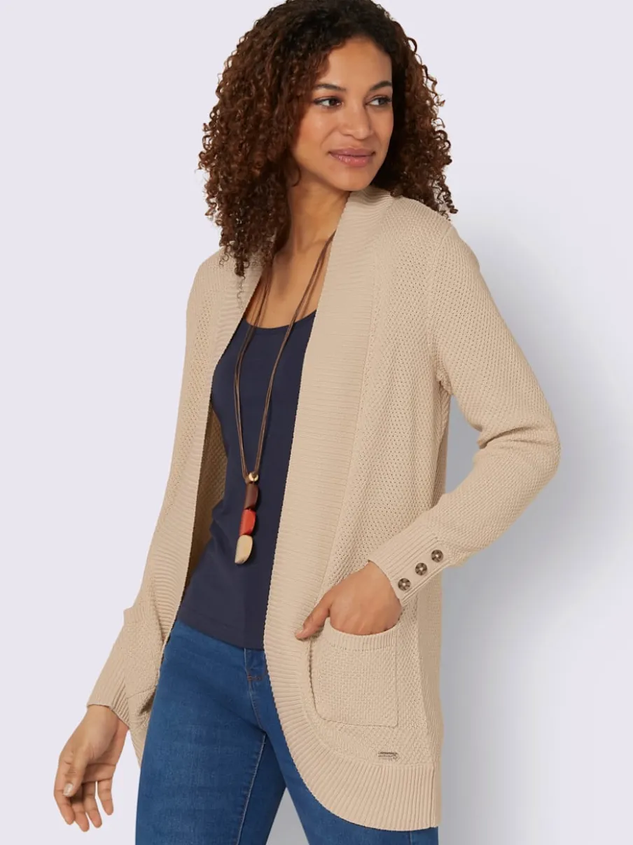 Veste longue en tricot avec poches et boutons côtelés