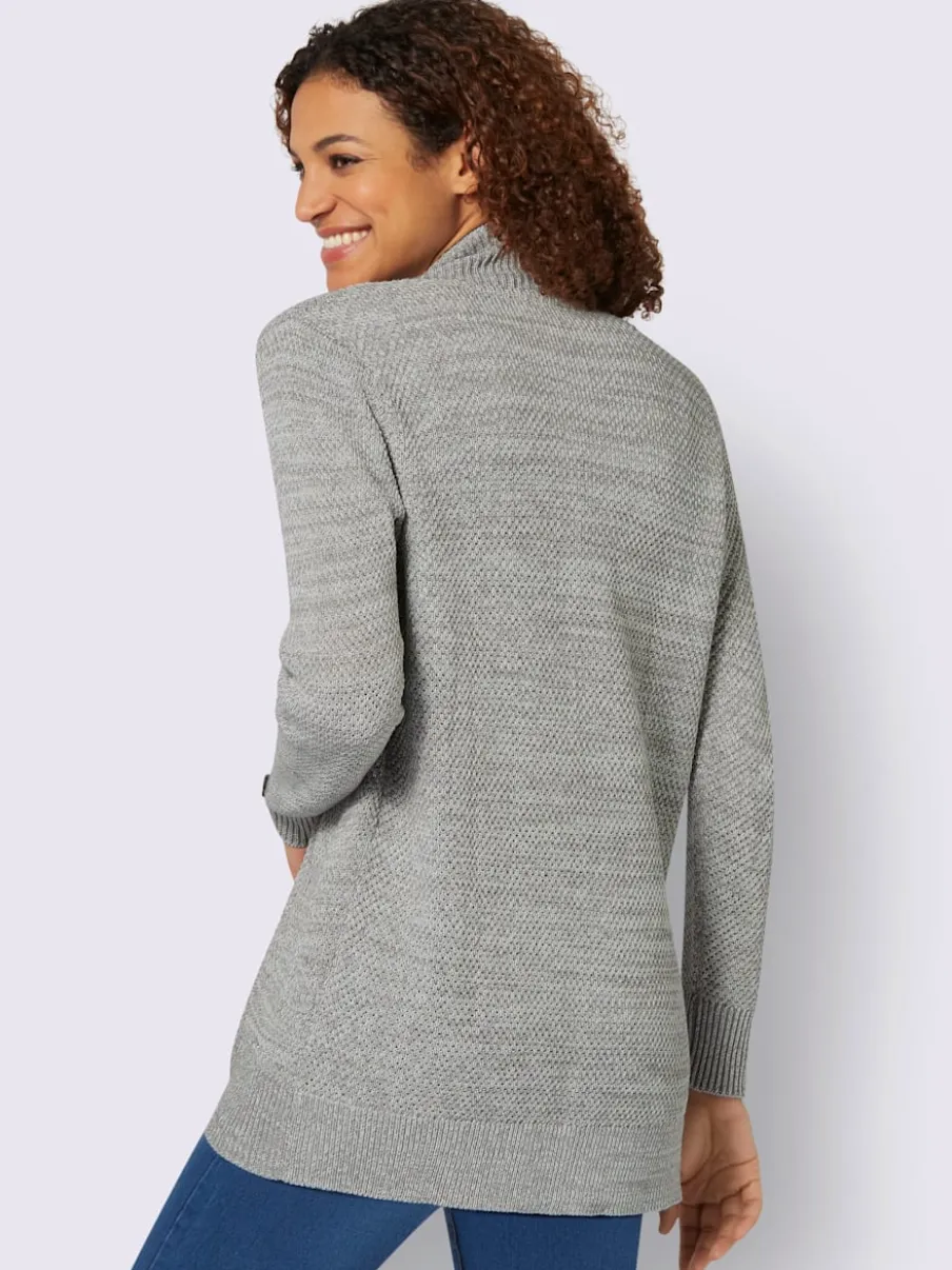 Veste longue en tricot avec poches et boutons côtelés
