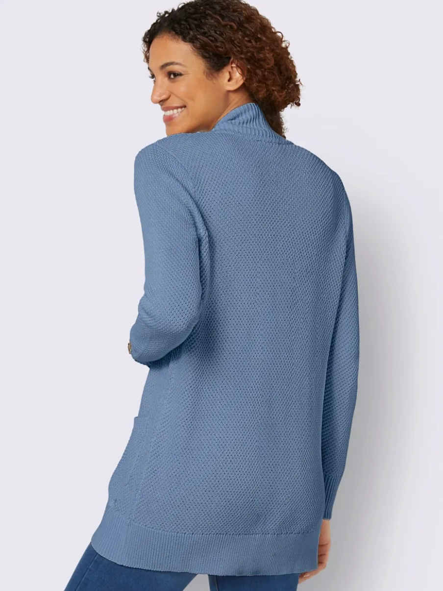 Veste longue en tricot avec poches et boutons côtelés