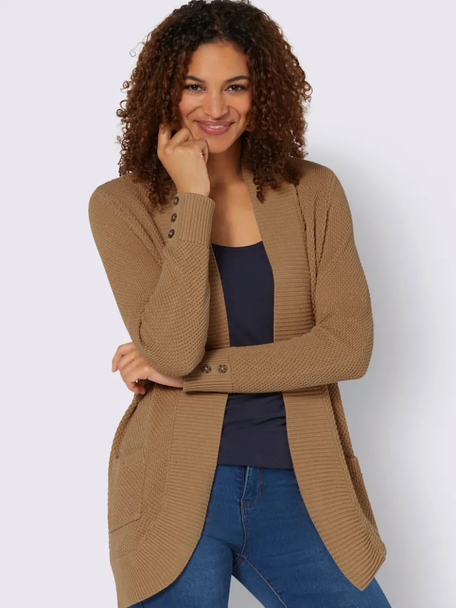 Veste longue en tricot avec poches et boutons côtelés