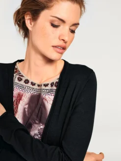 Veste longue en tricot à col montant avec poches et manches longues