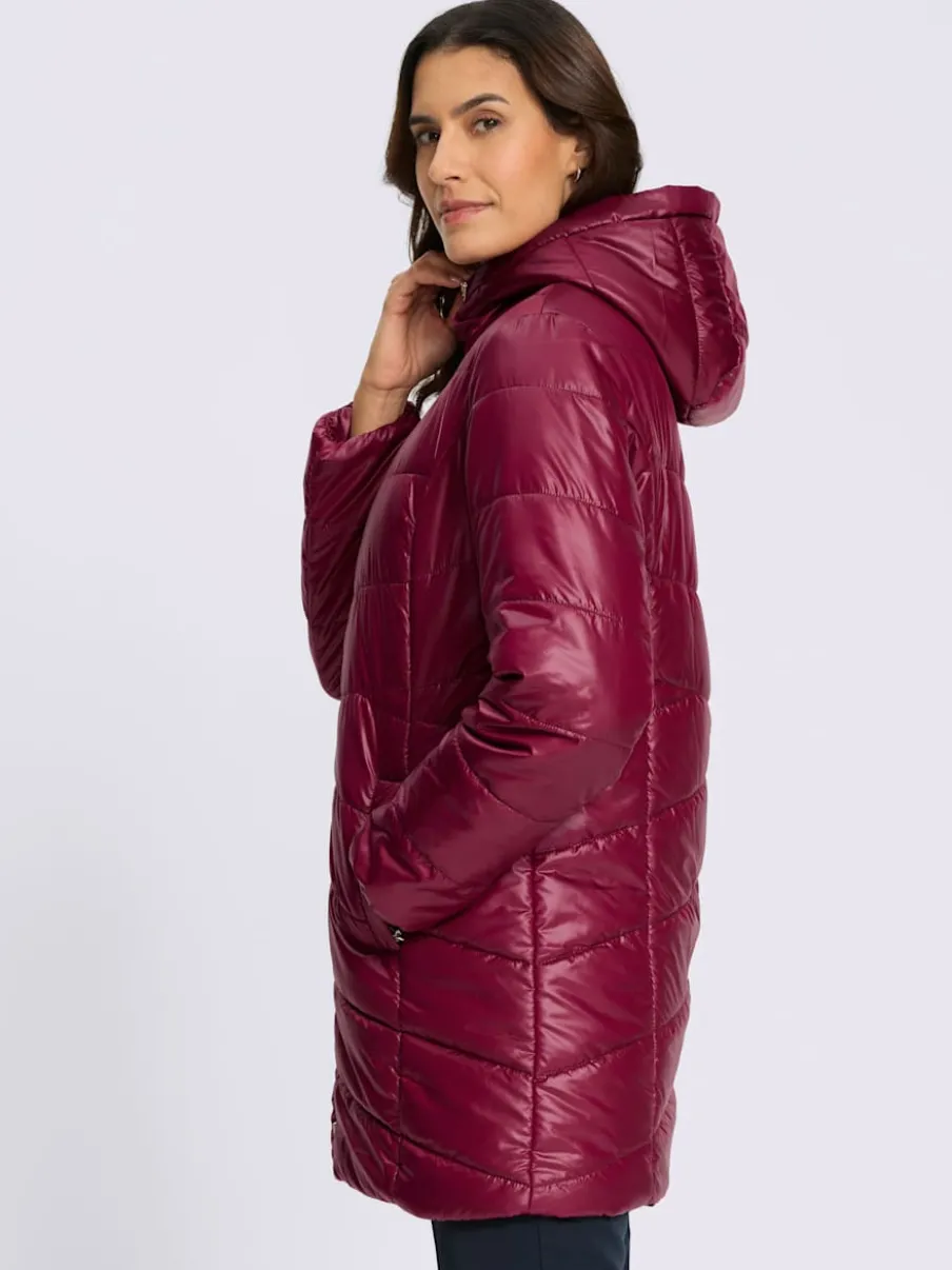 Veste longue matelassée avec capuche et poches pratiques