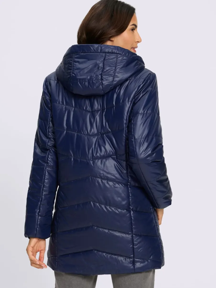 Veste longue matelassée avec capuche et poches pratiques