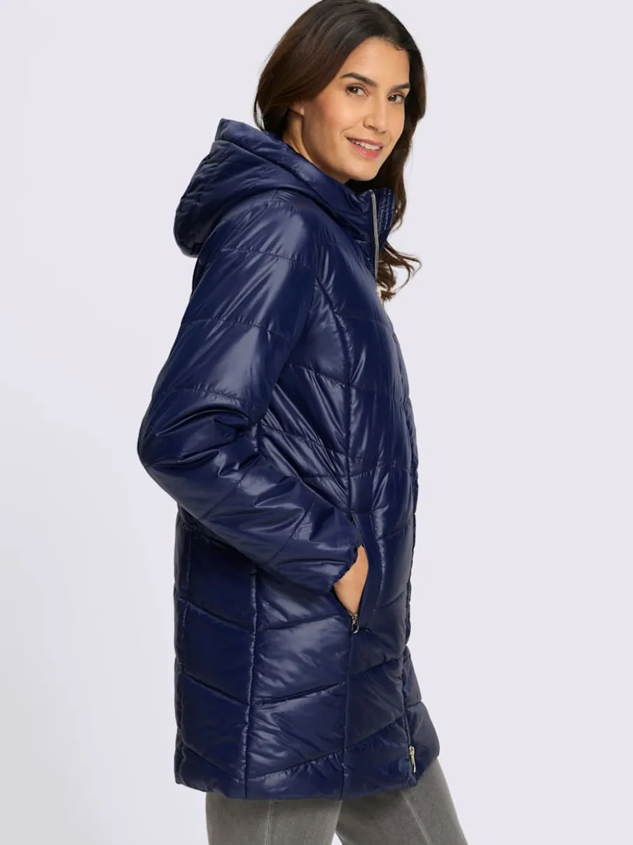 Veste longue matelassée avec capuche et poches pratiques