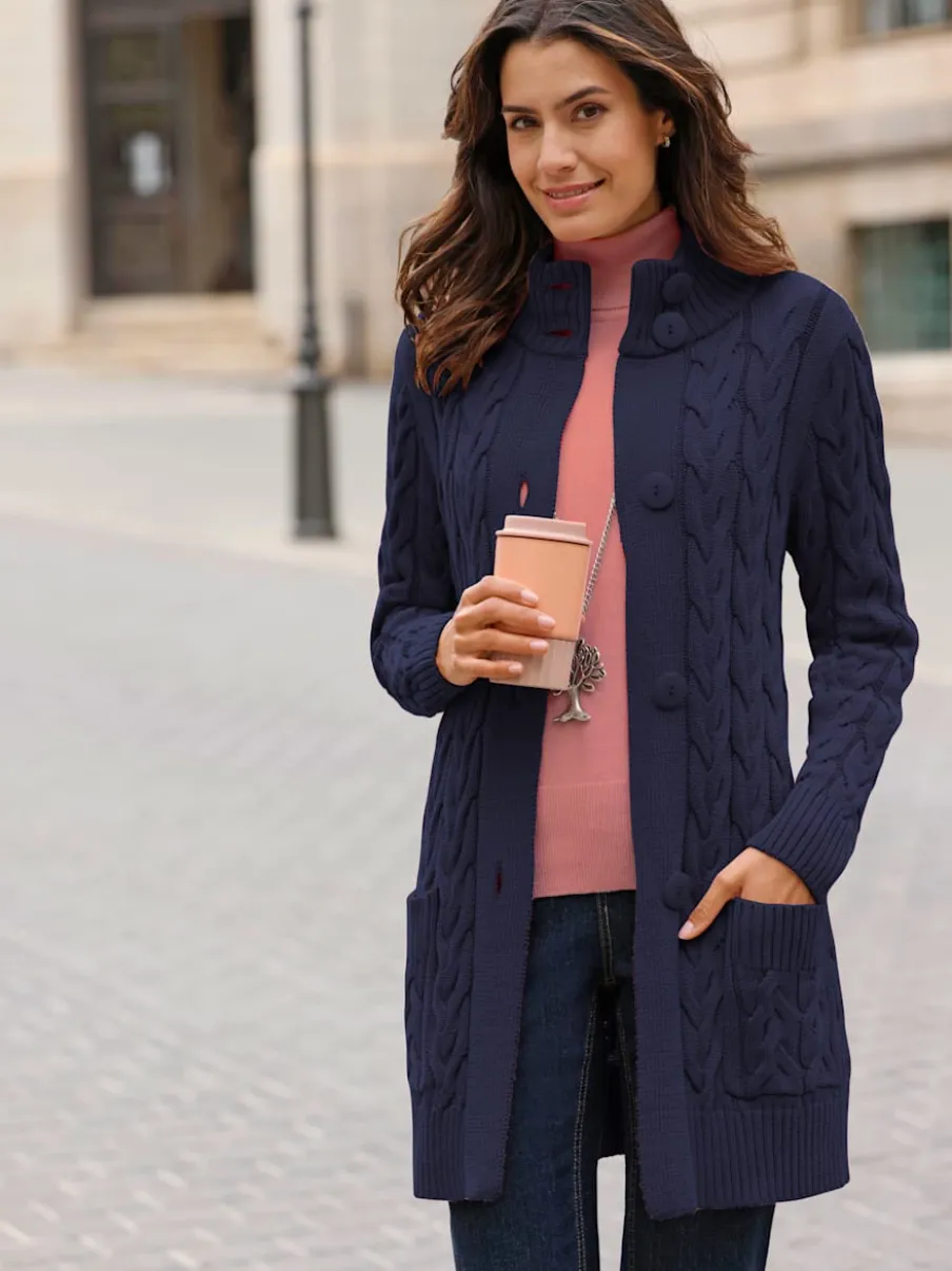 Veste longue tricotée avec col montant et poches